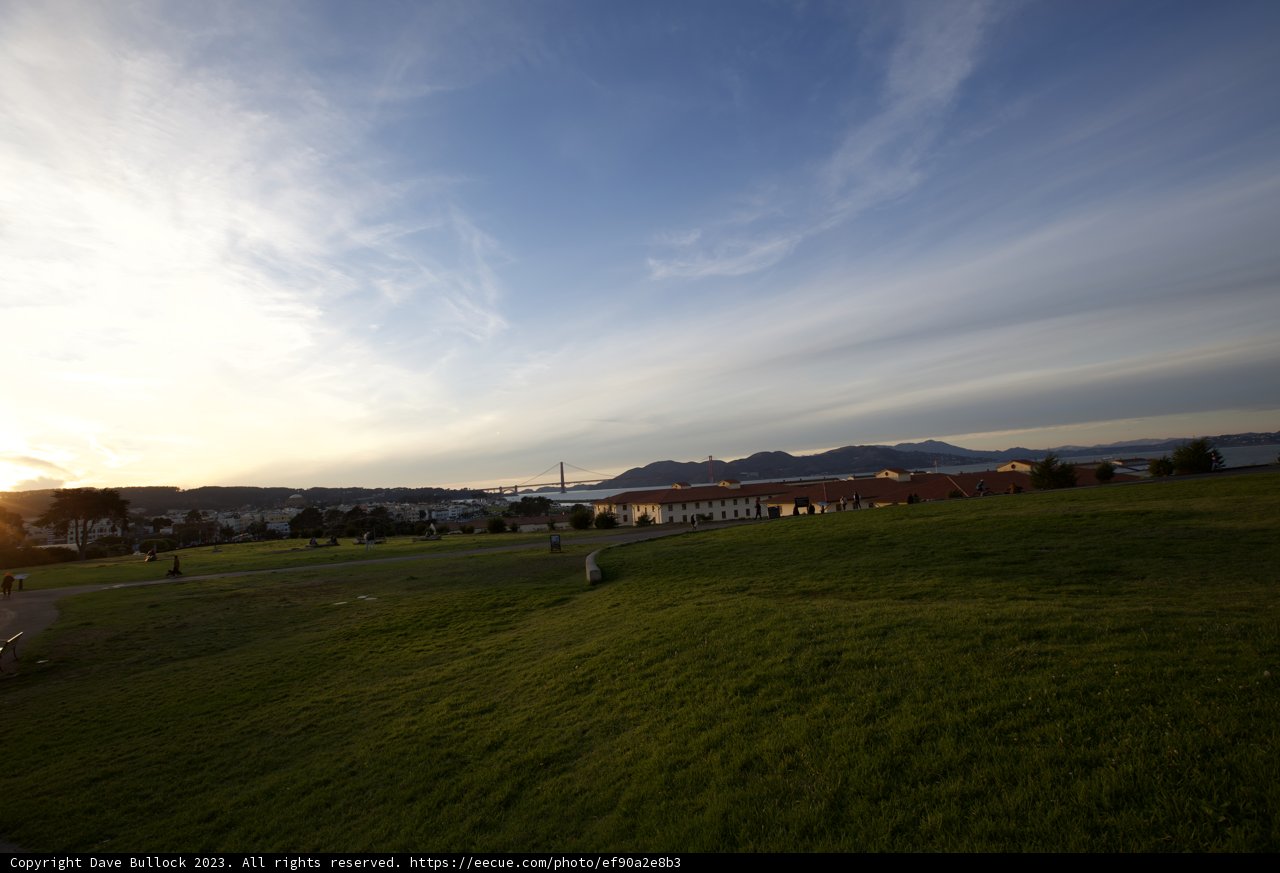 Embracing the Horizon: A Kite, A Field, and a Sunset