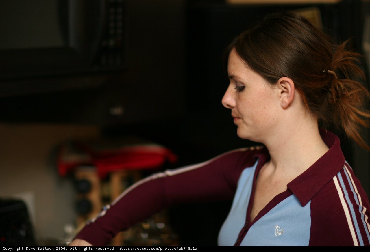 Young Woman in Profile at Indoor Venue