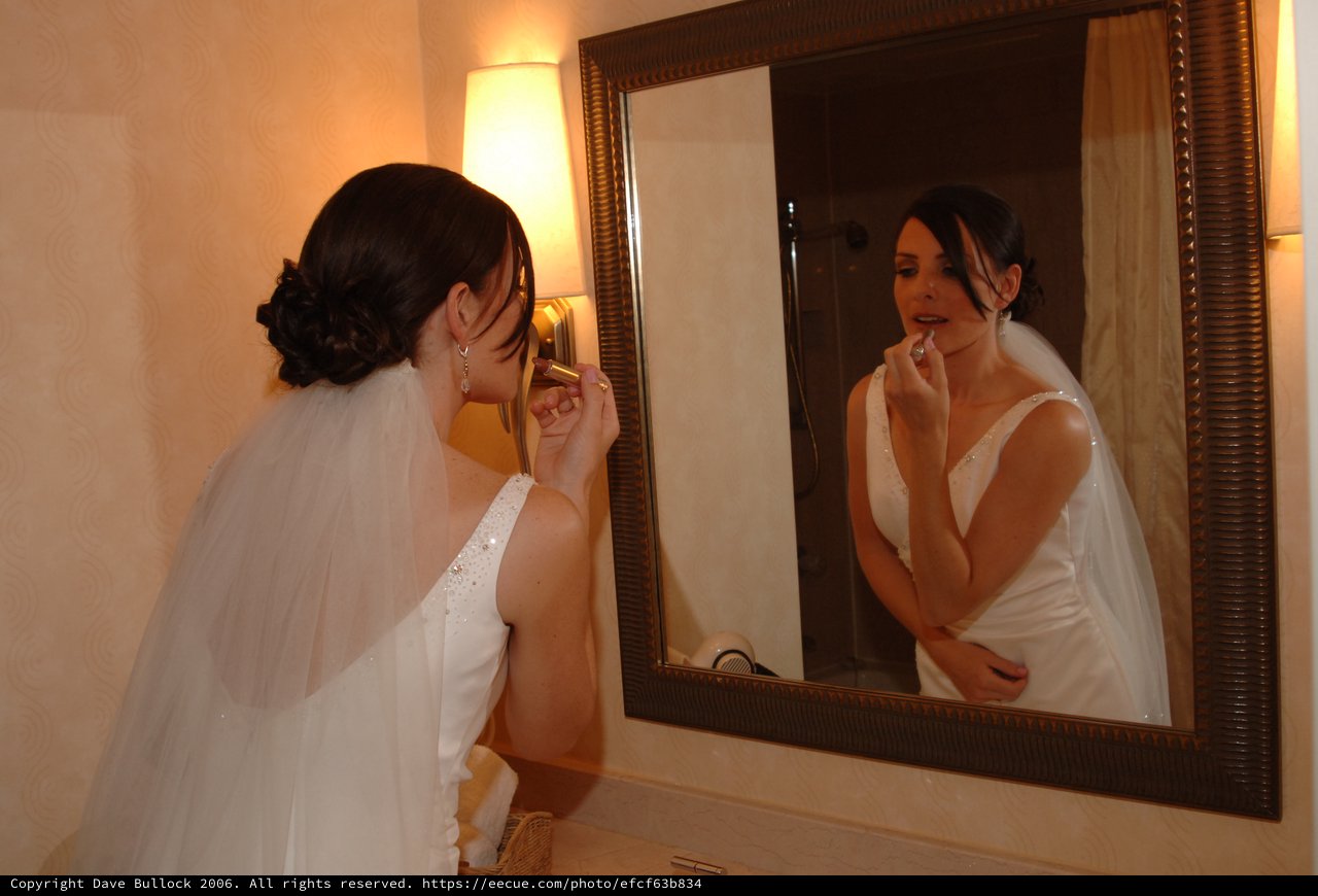 Bride Applies Lipstick Before Wedding Ceremony
