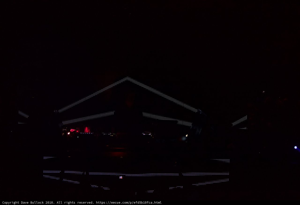 Man in Silhouette on Illuminated Stage