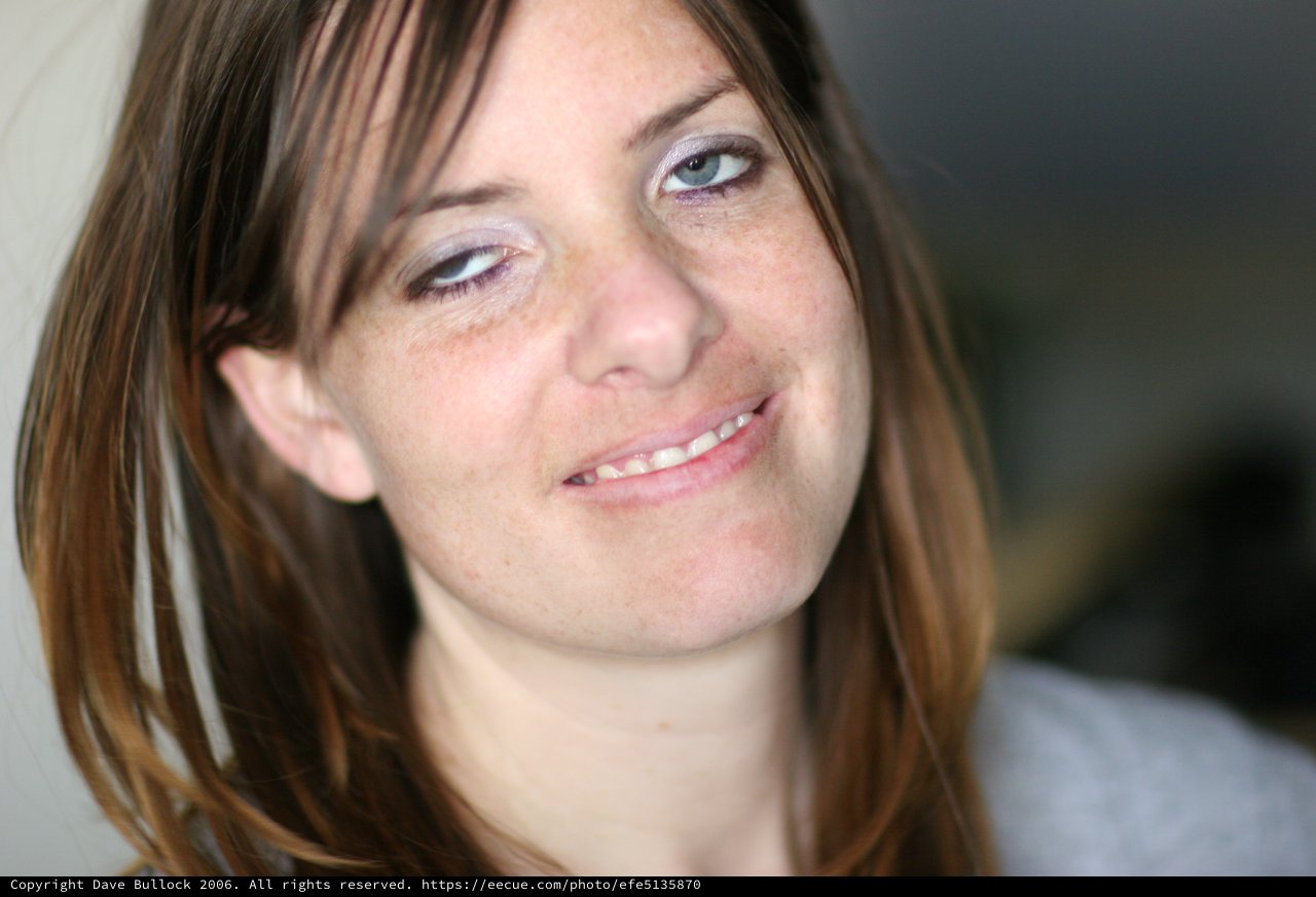 Candid Portrait of Smiling Young Woman Indoors