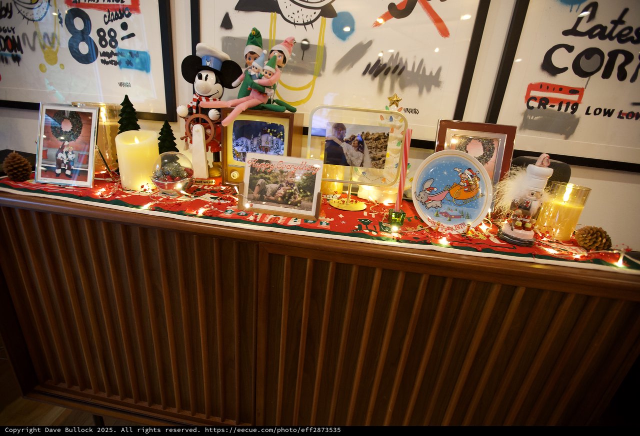 Festive Christmas Display with Disney Decorations and Family Photos