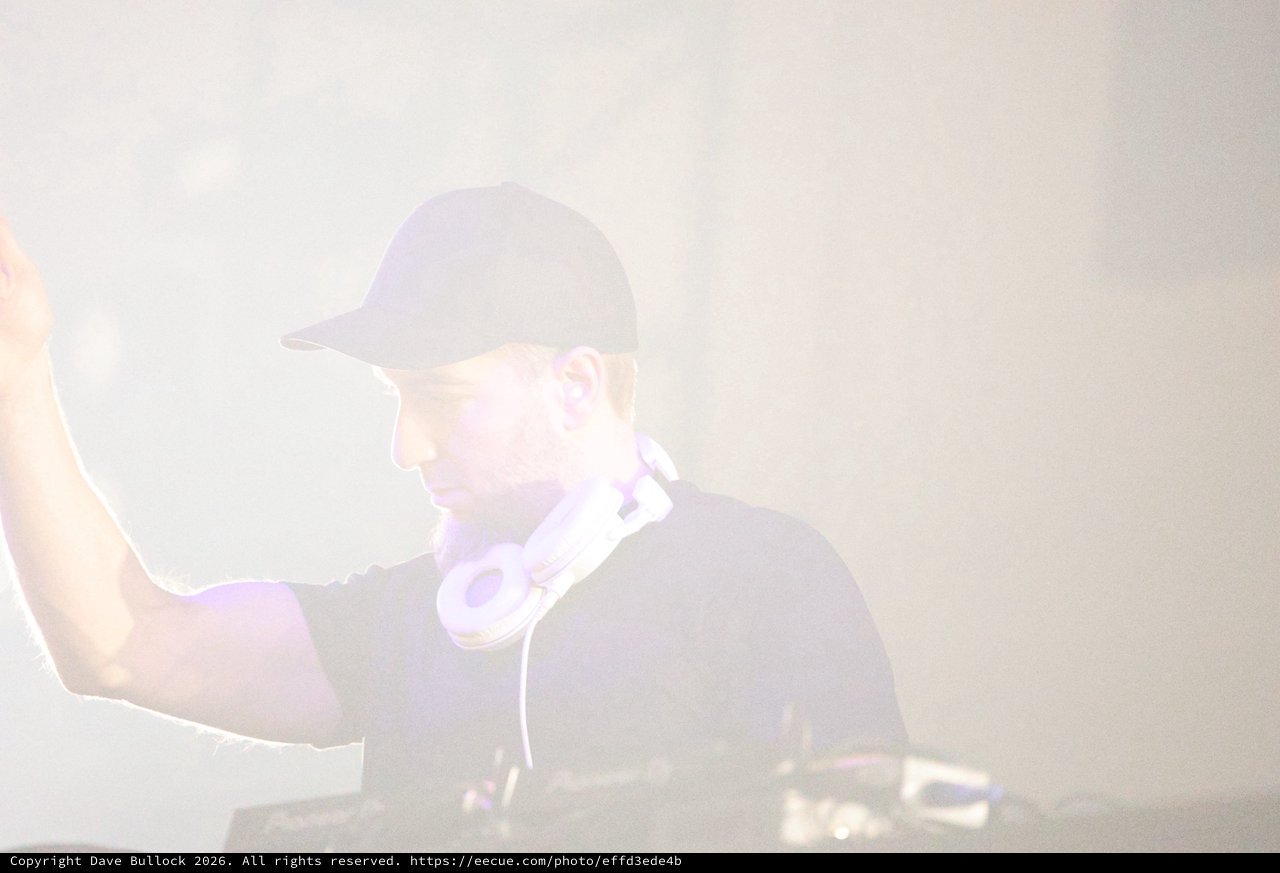 DJ Commands the Stage Through Ethereal Fog
