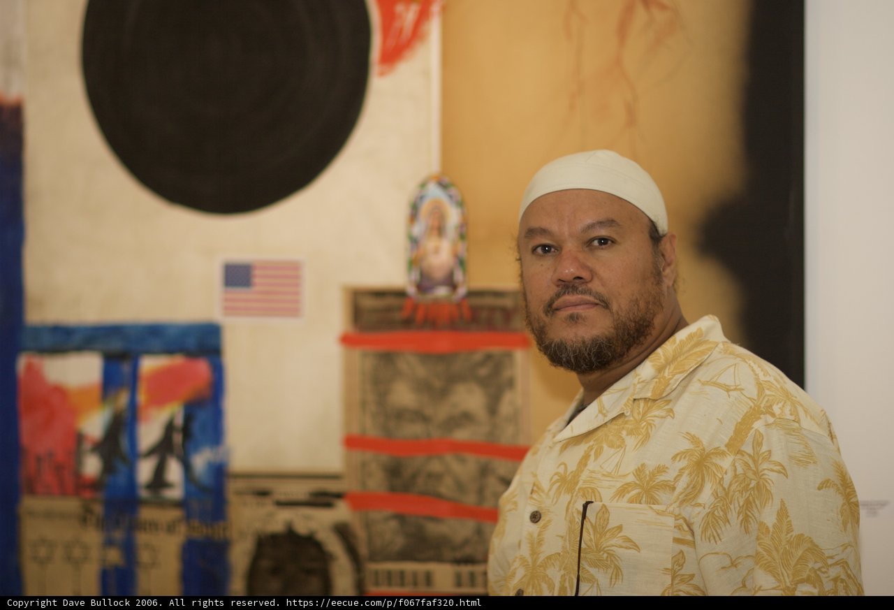 Man in White Hat Contemplating a Painting