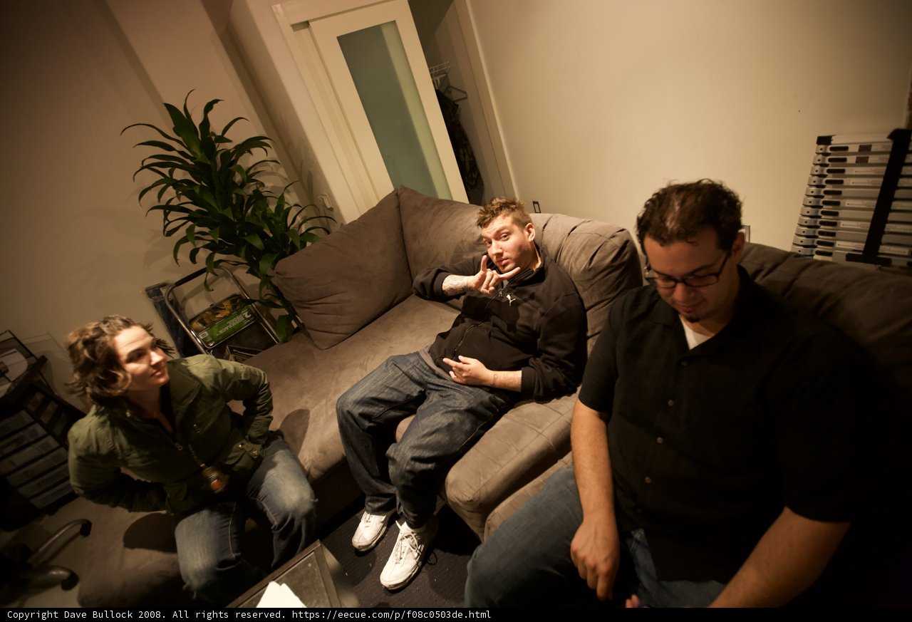Three Men Lounging on a Comfy Couch