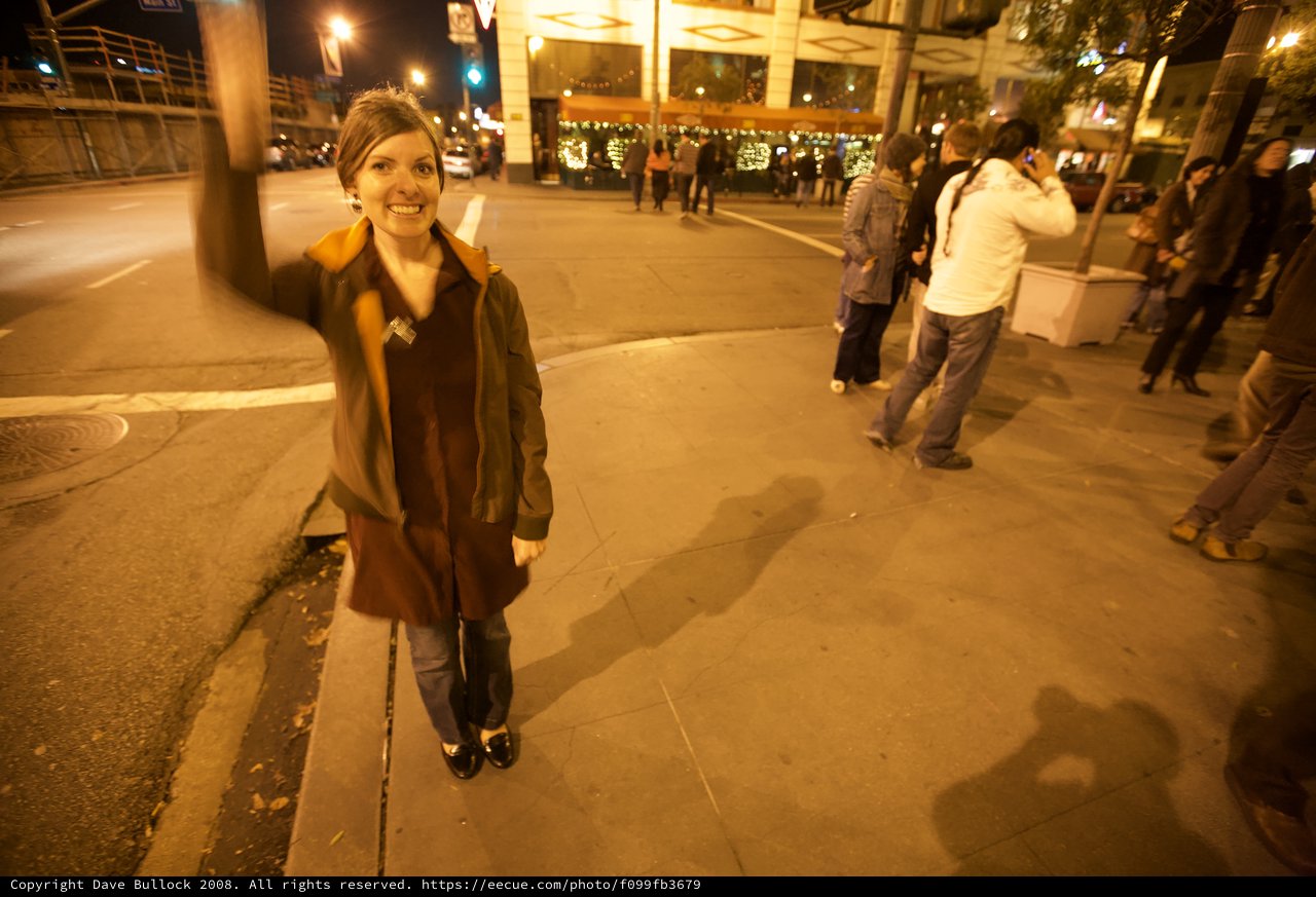Woman on City Street During Evening Celebration