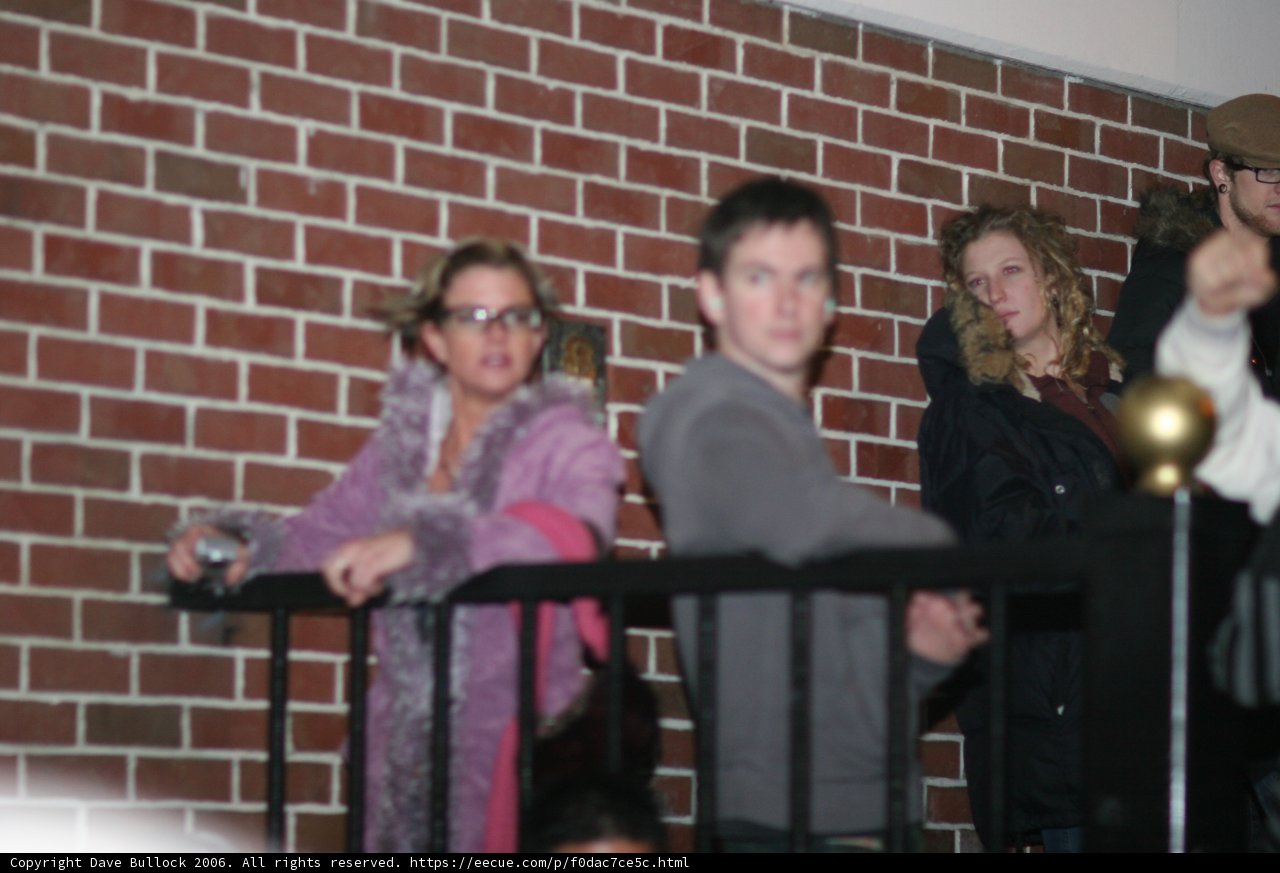 Group of Five Friends Enjoying the View from Balcony