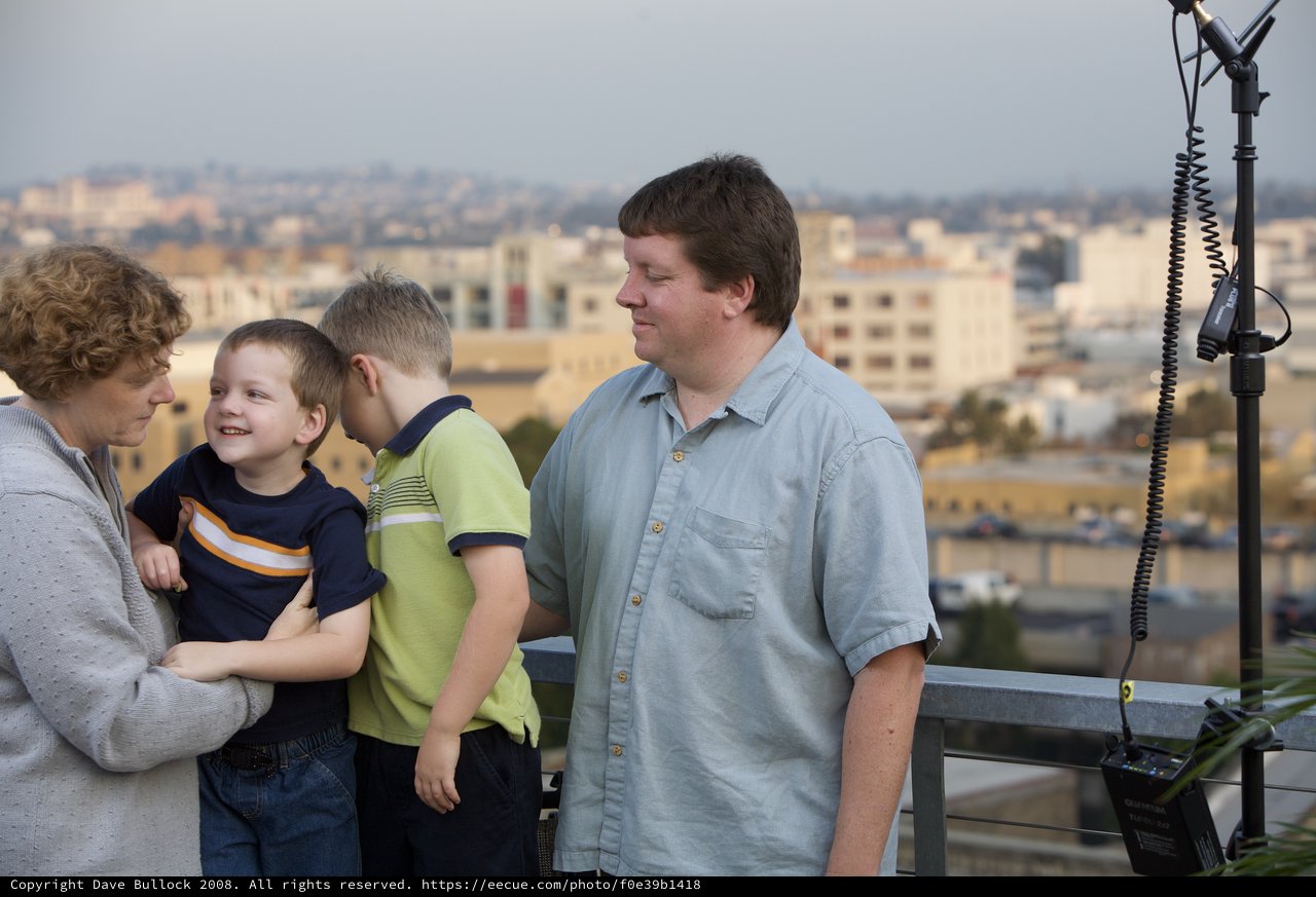 Family Moment on Urban Rooftop at Dusk