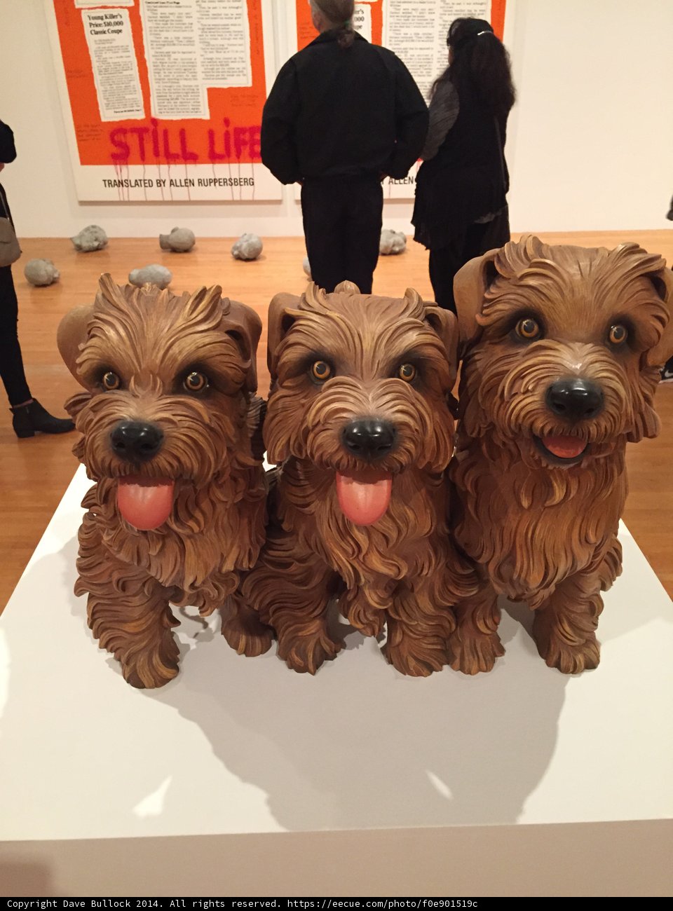 Three Terrier Statues Adorn a Wooden Table