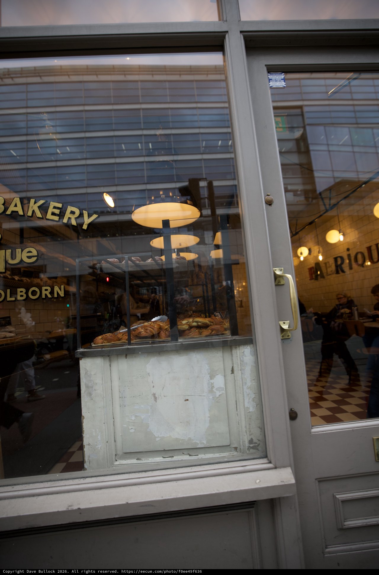 Holborn Bakery Storefront Window Display at Dusk