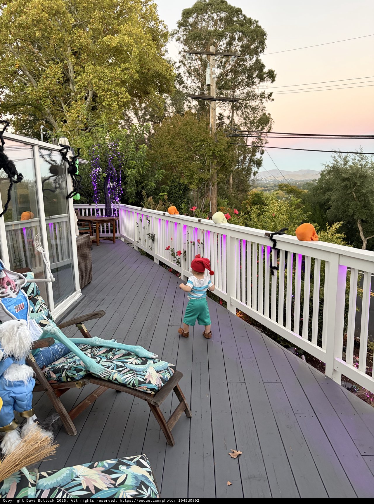 Child Explores Decorated Deck During Smoky Conditions