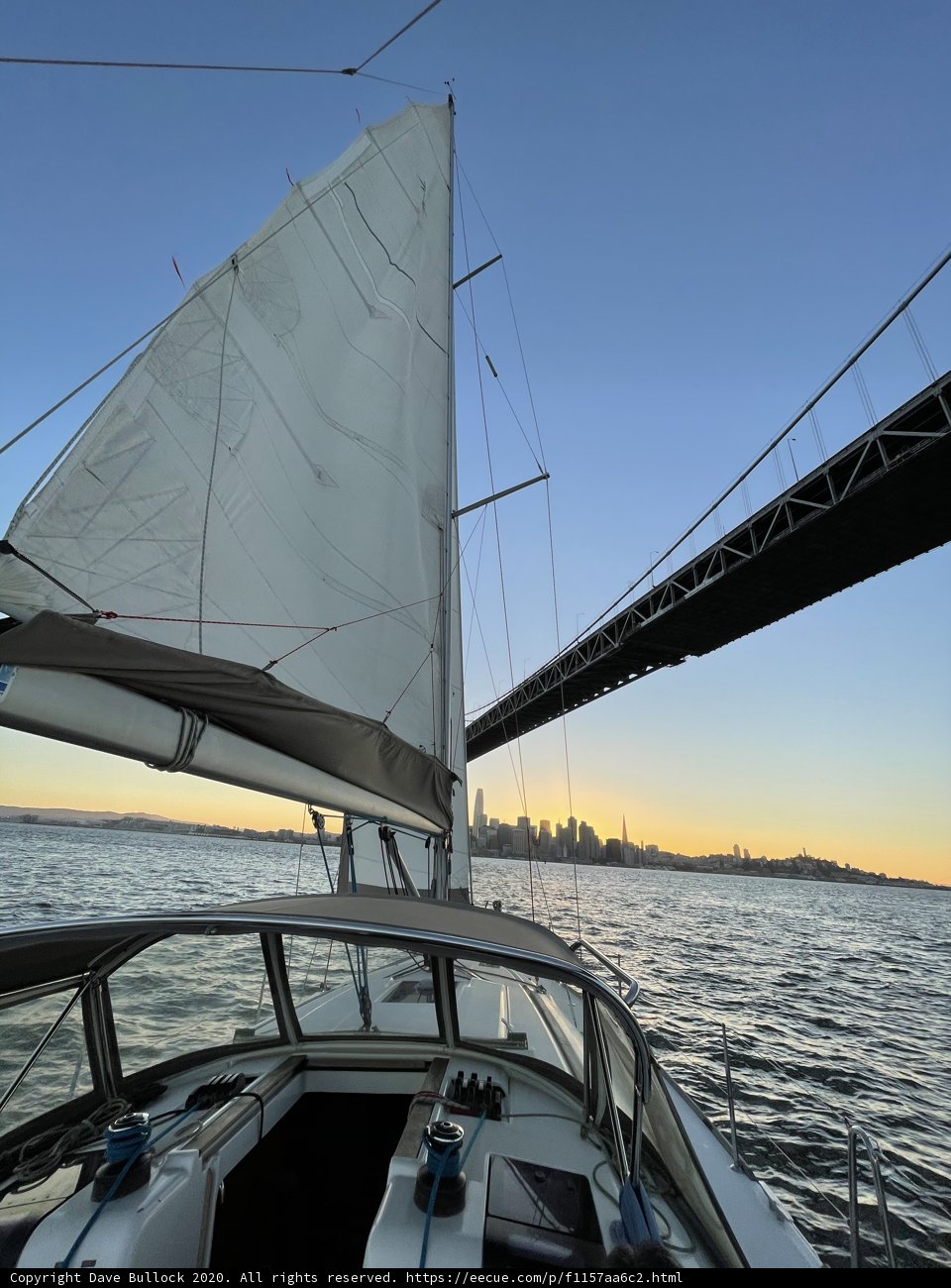 Sunset Sailboat Under Golden Gate Bridge