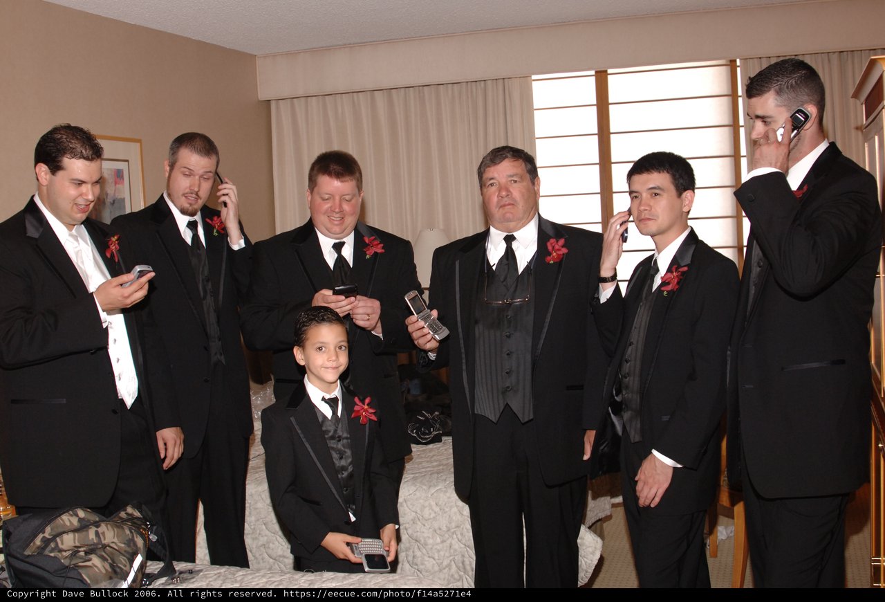 Groomsmen Distracted by Phones Before Wedding Ceremony