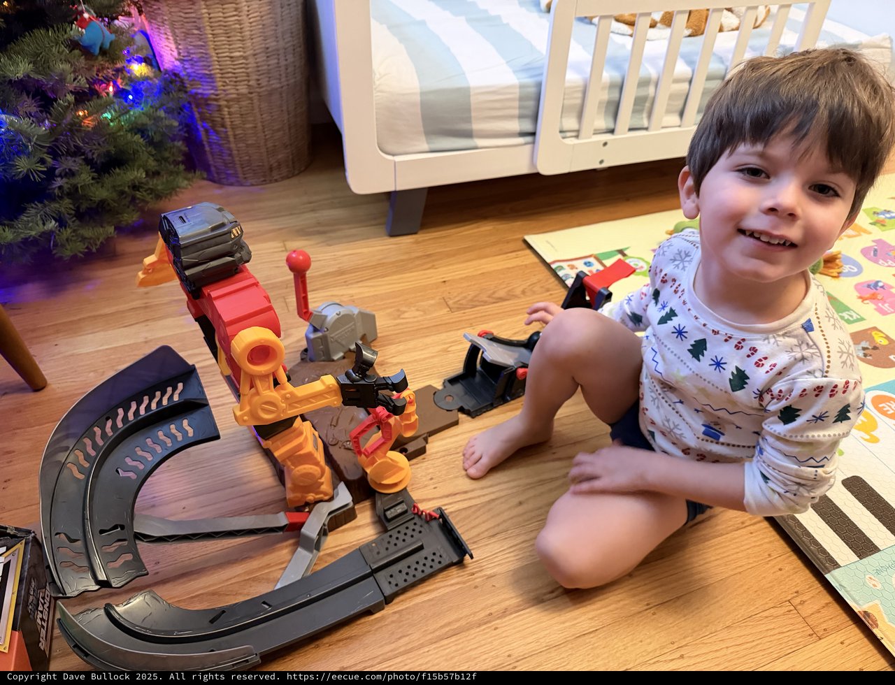 Happy Child Playing with Construction Toy Set at Christmas