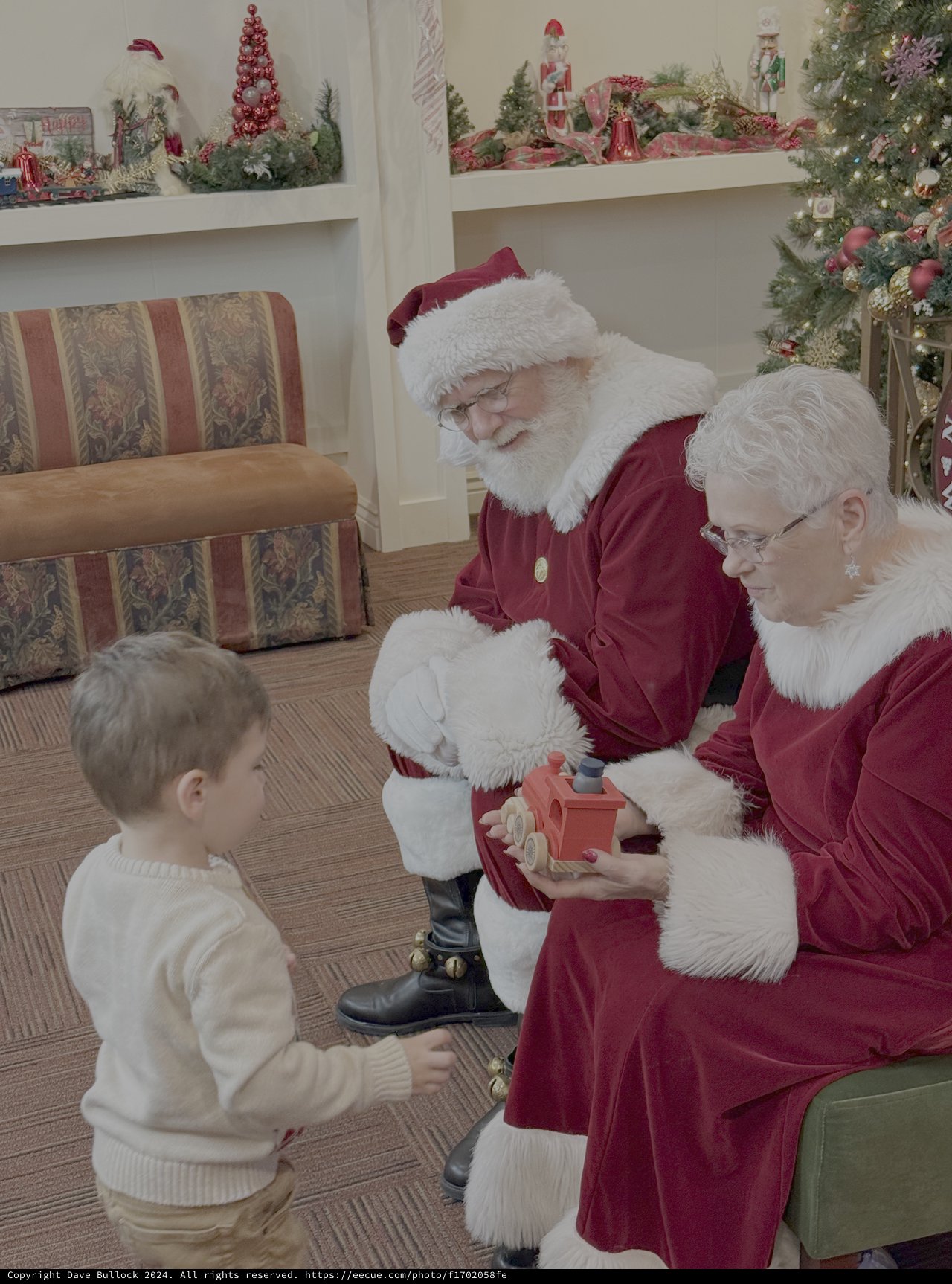 Santa Visits Child at Christmas Celebration
