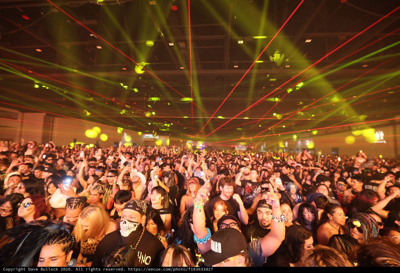 Massive Crowd Erupts Under Laser Light Show
