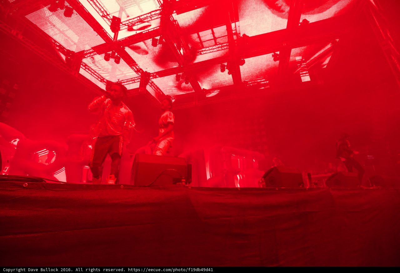 Red-Lit Concert Crowd