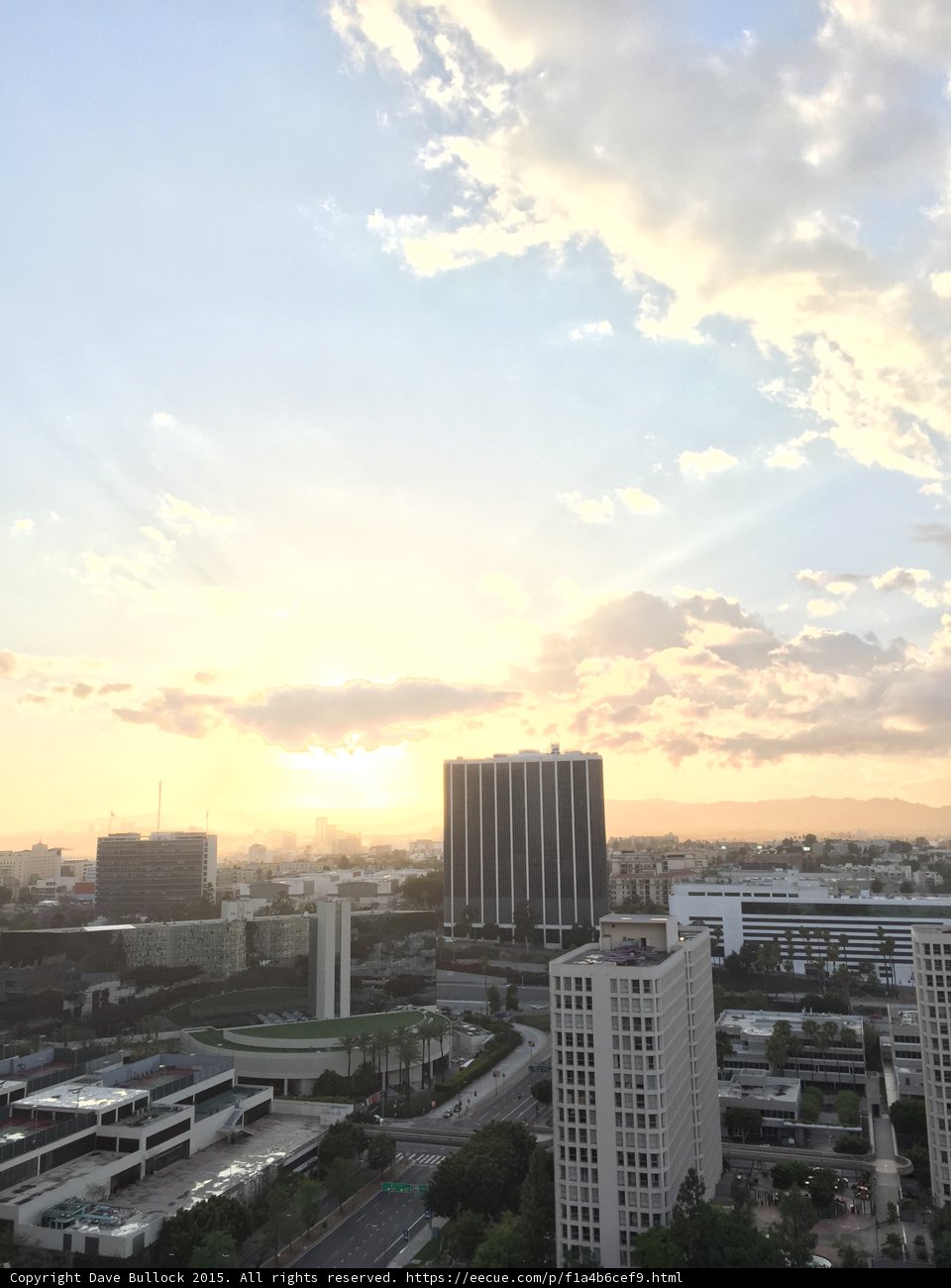 Sun sets over the urban skyline