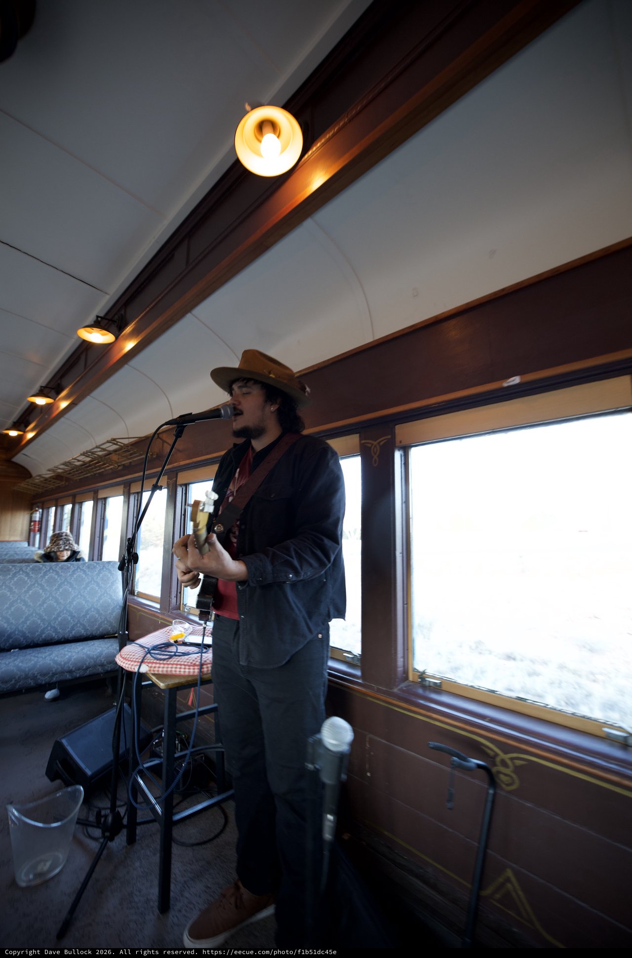 Musician Performing on Vintage Train Car