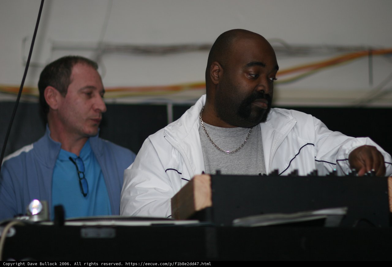 Electronic Musician in White Lab Coat and Blue Shirt
