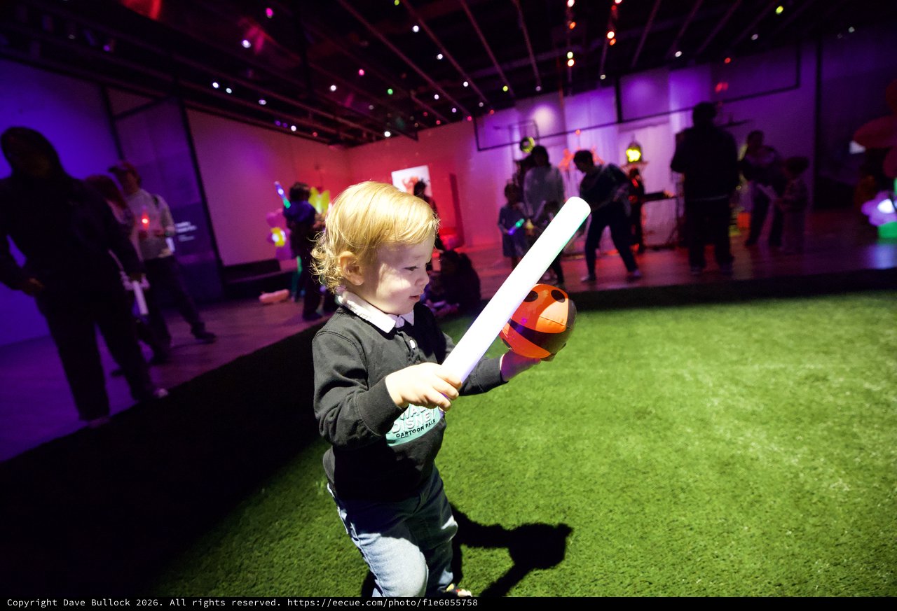 Child with Light Saber at Baby Rave Event