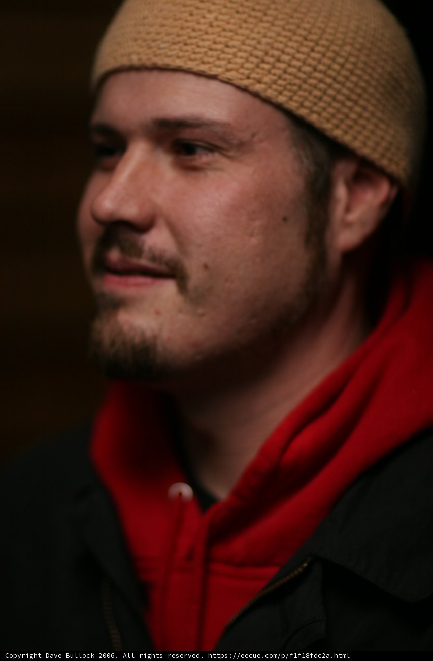 Red-Hooded Man in a Beanie