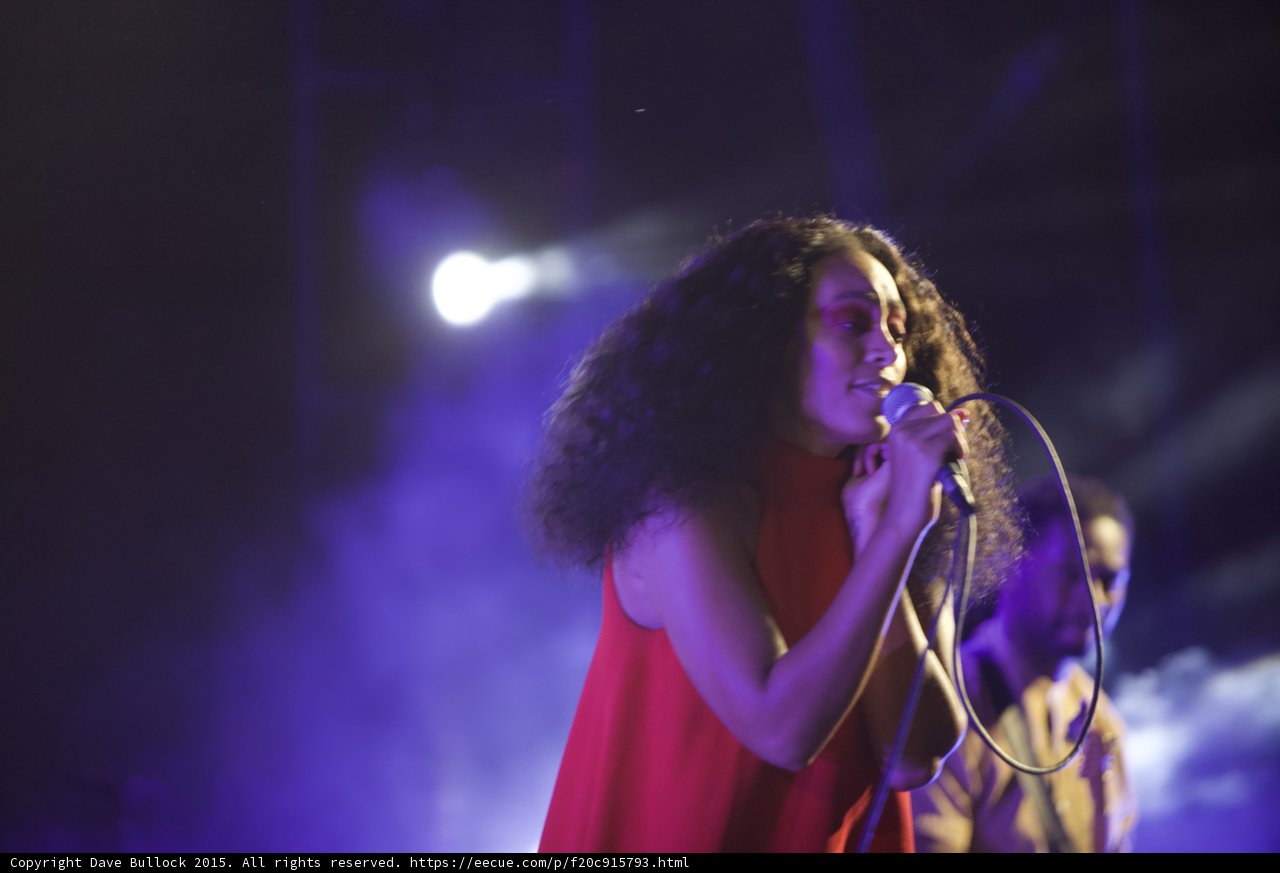 Solange Smiling Softly Singing Guitarist Background Purple