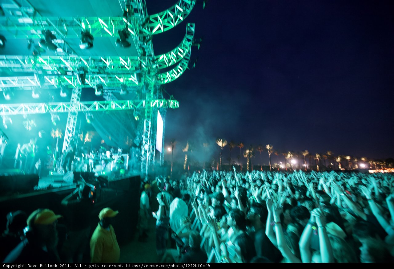 Green Lights Illuminate Rock Concert Crowd