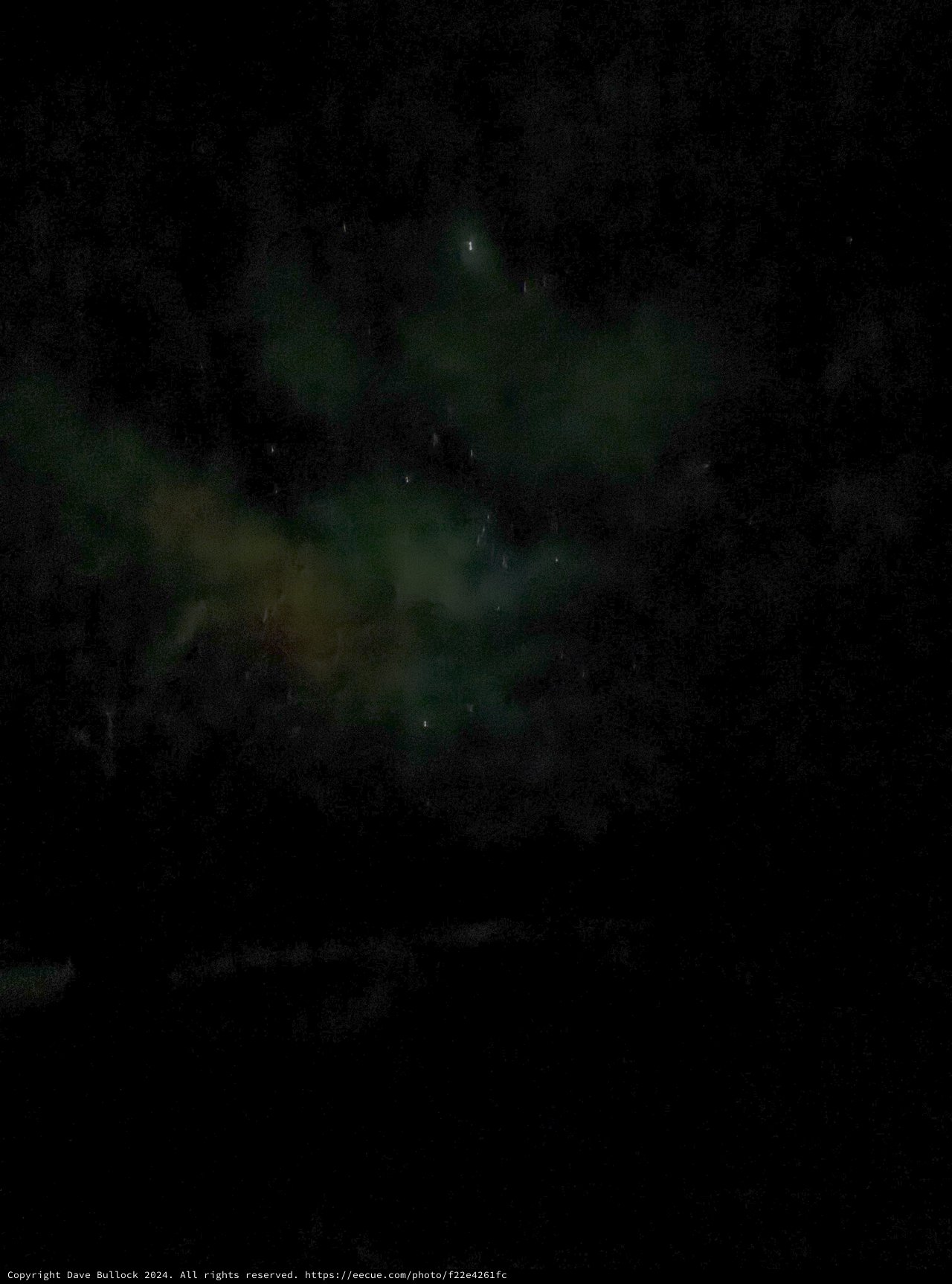 Ethereal Green Aurora Dancing Across Night Sky