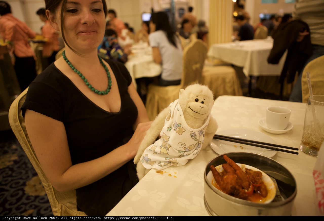 Stuffed Monkey Joins Dim Sum Dinner in Restaurant