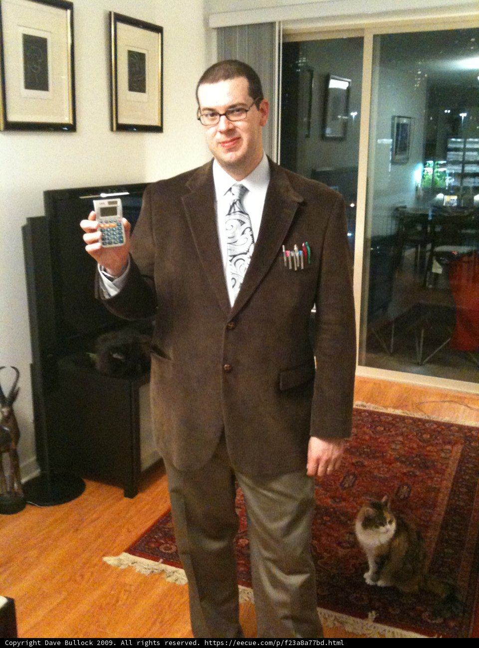 Holding the Spirits Caption: Dave B poses for a portrait while holding a bottle of fine liquor in Los Angeles. His blazer adds a touch of formal wear to the shot.