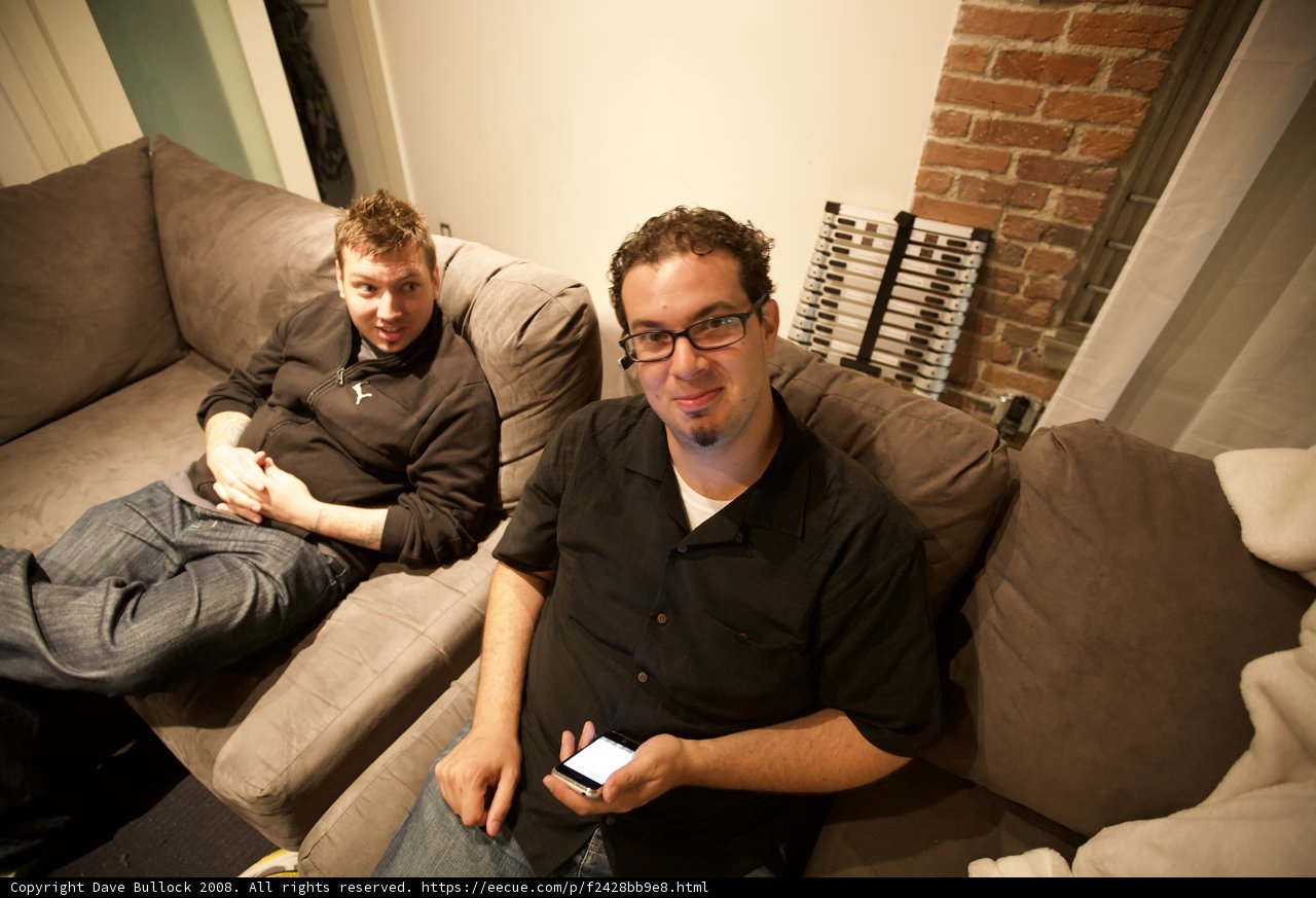 Two Men Relaxing on a Cozy Couch