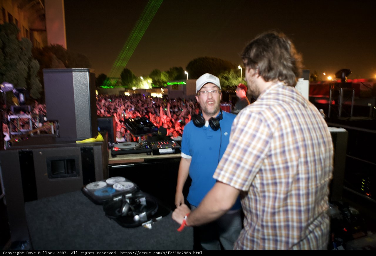 Two Men Grooving to the Beat at a Concert