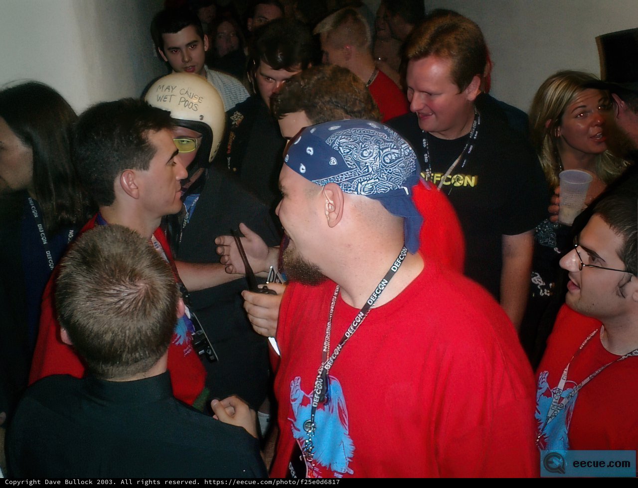 Red-shirted group discussing at a baseball game