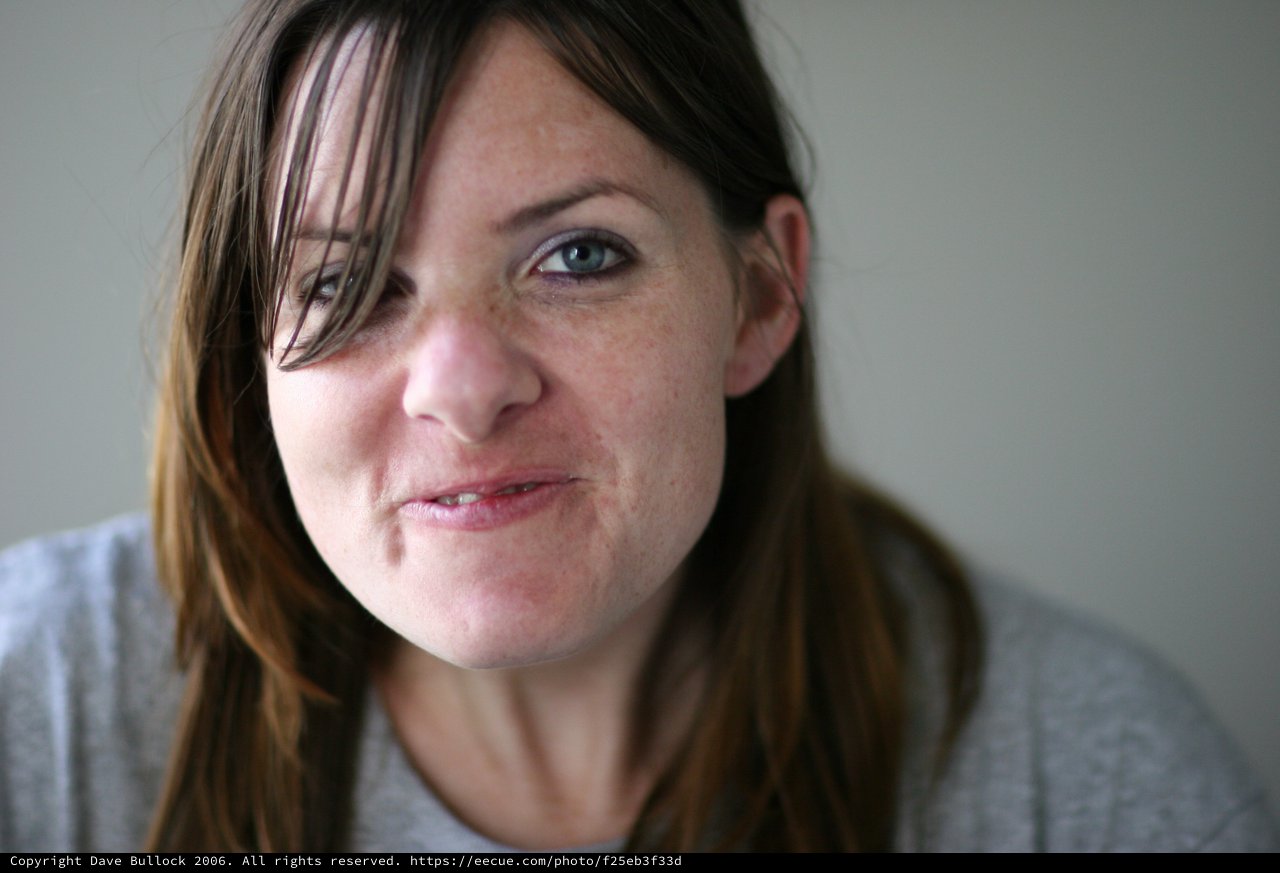 Candid Close-Up Portrait of a Young Woman Smiling