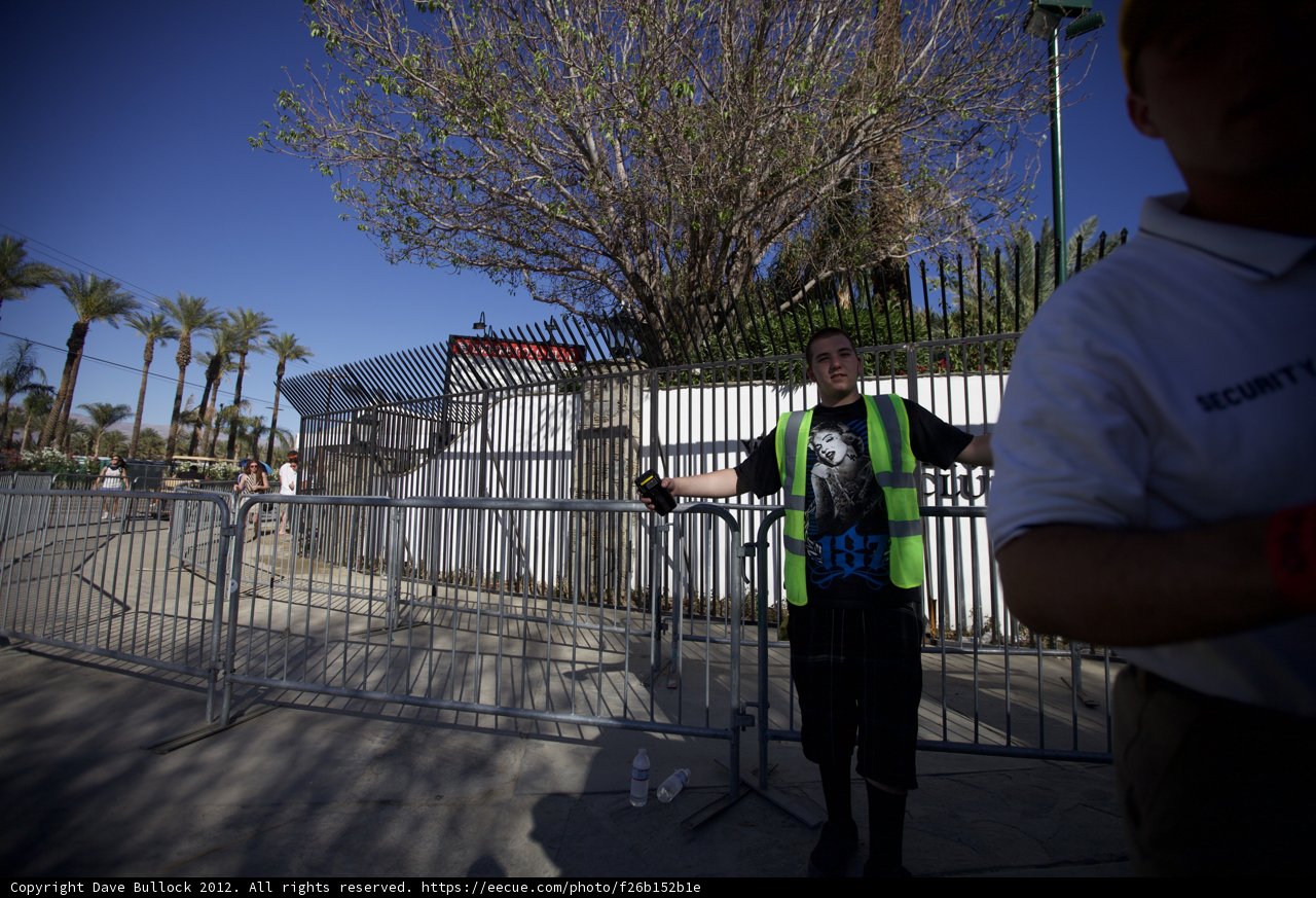 Yellow Vest Worker by the Fence