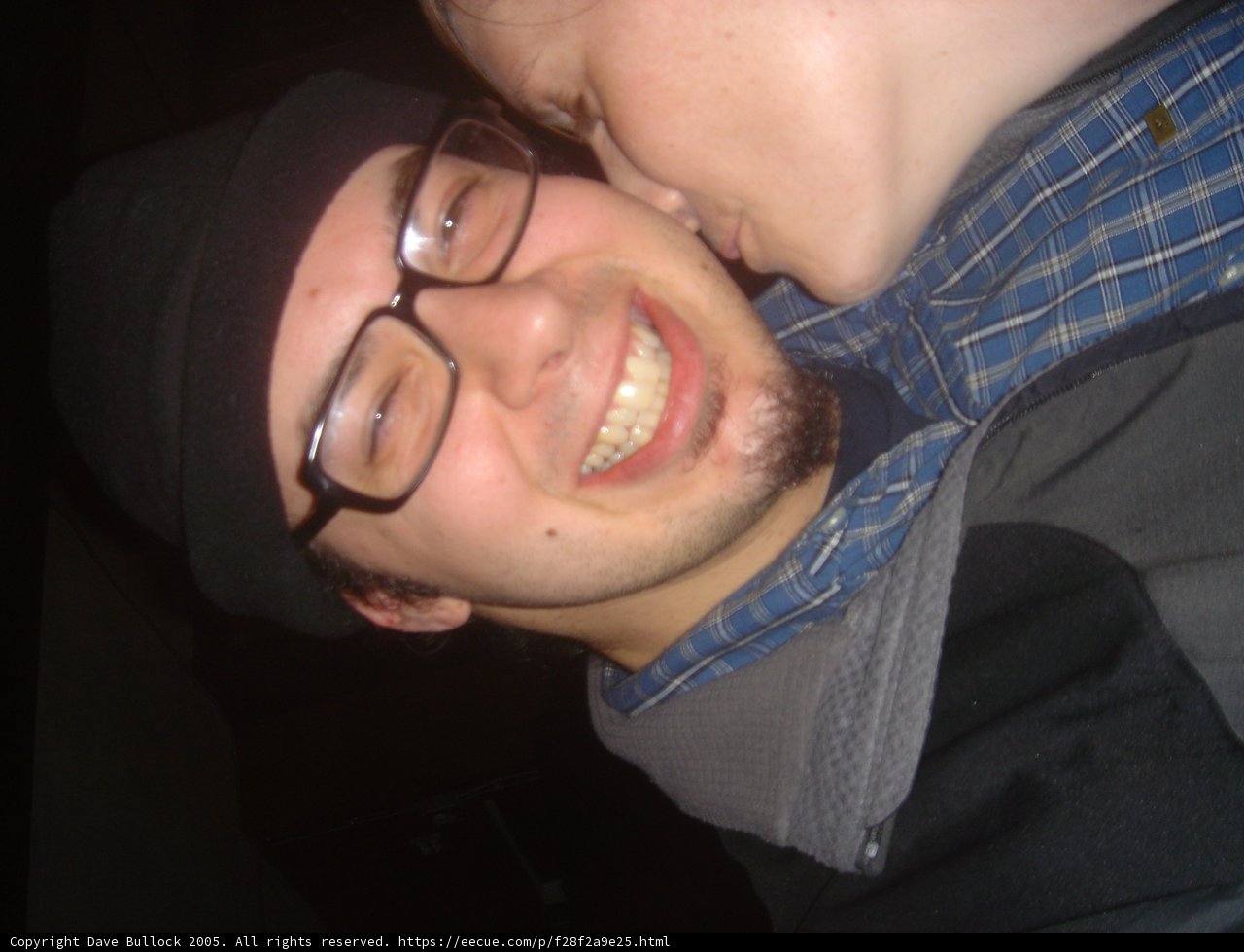 Smiling and Kissing Couple