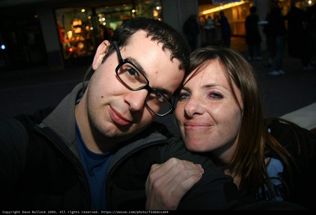 Couple Shares a Playful Moment on City Street