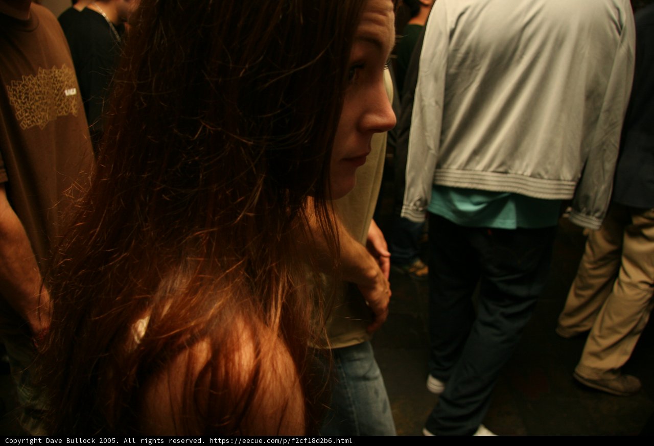 Long-Haired Woman Rocks Denim in the Club