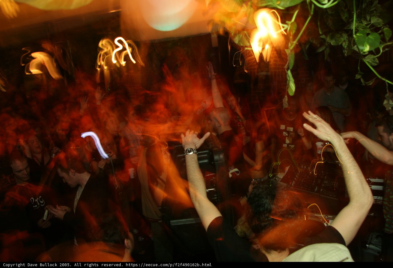 Party People in Club with Fiery Atmosphere