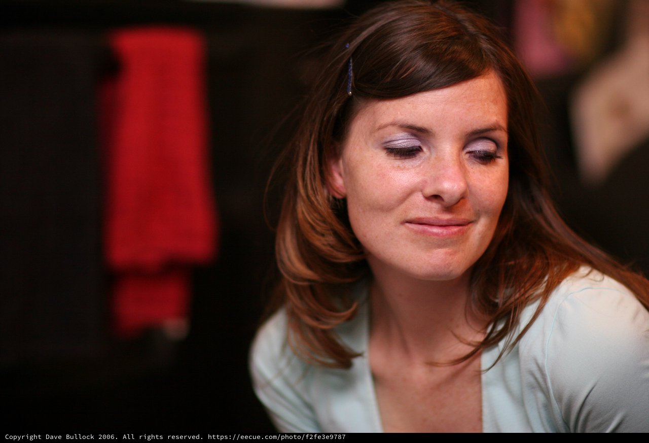 Contemplative Woman in Soft Indoor Light
