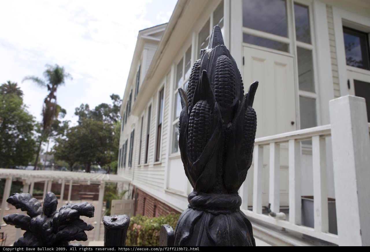 Corn Statue Adorns Fence in Front of Historic Monastery House