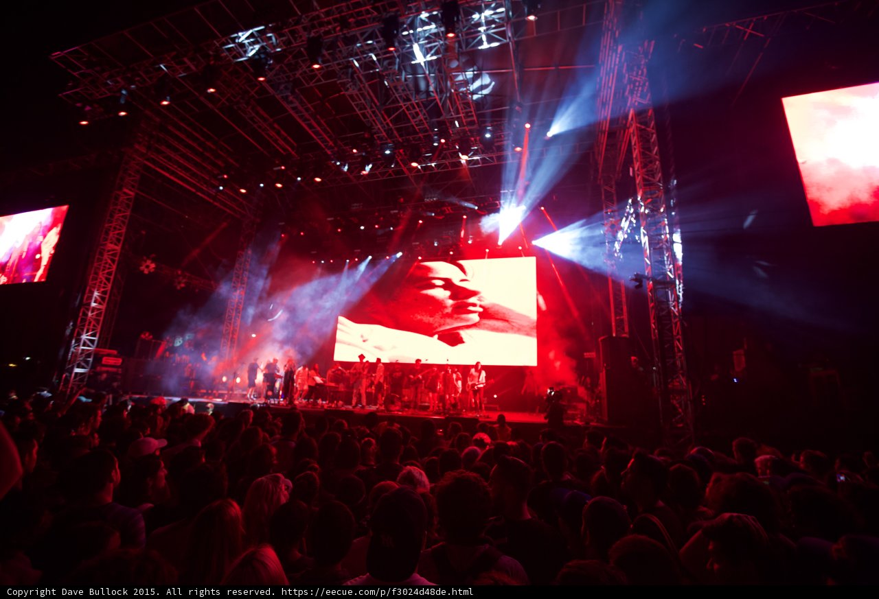 Belle and Sebastian Wide Stage Video Screen Face Portrait Red Lighting Spotlight Beams Finale