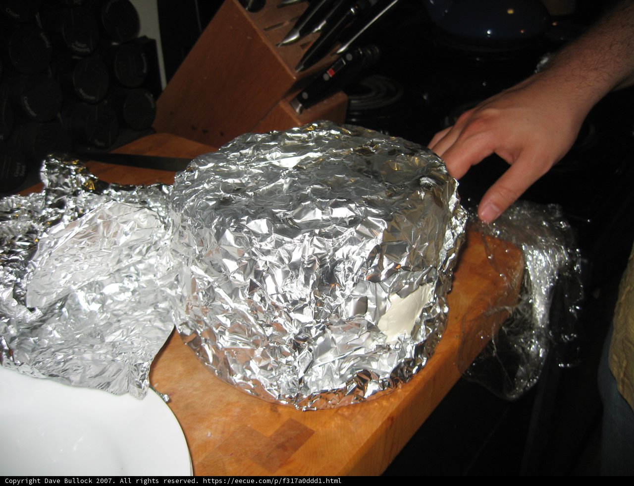 A Person Holding a Piece of Aluminium Foil