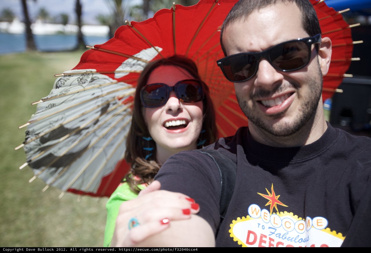 Couple Selfie at Coachella with Red Parasols