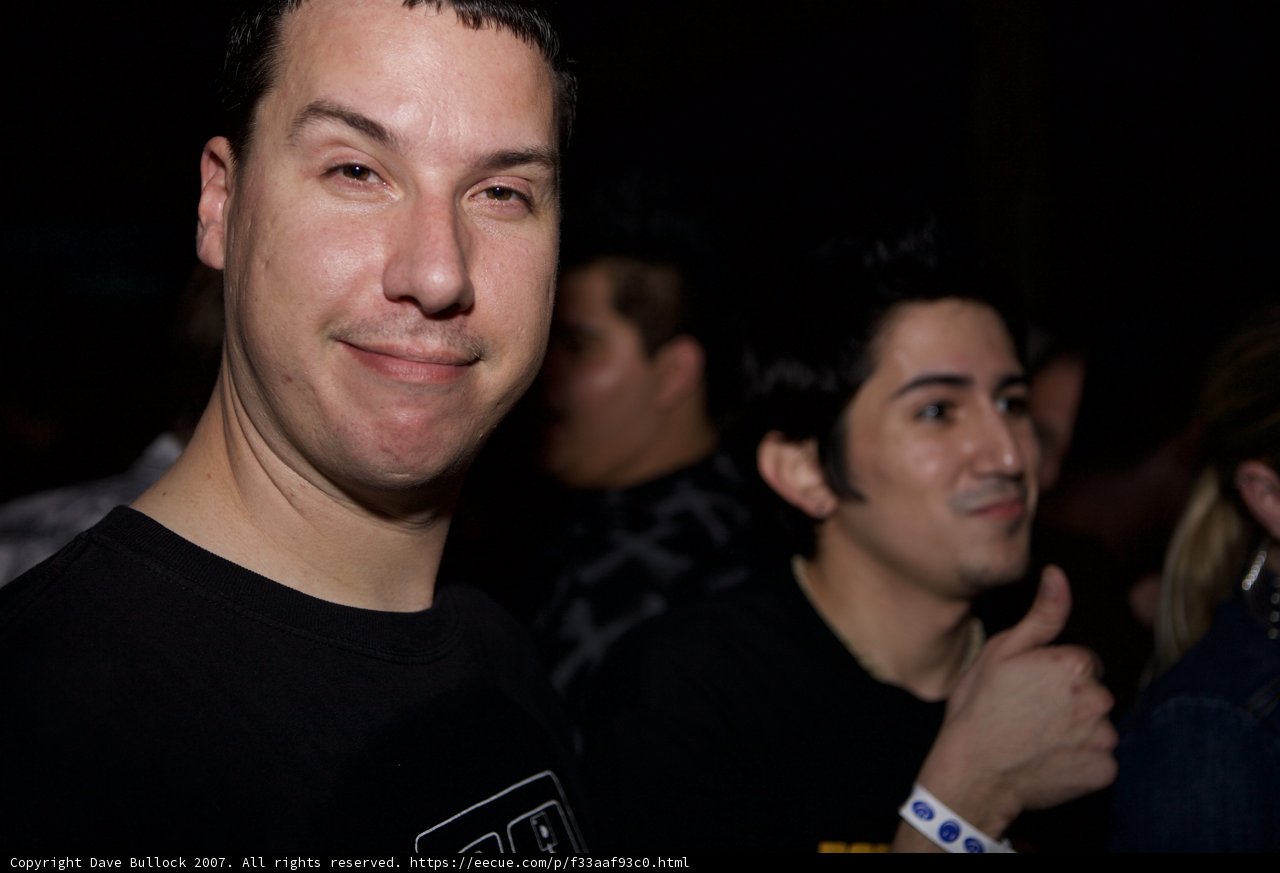 Smiling man at an urban night club