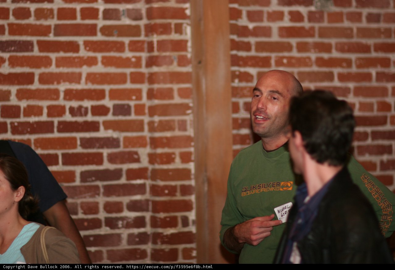 Discussing in Front of a Brick Wall