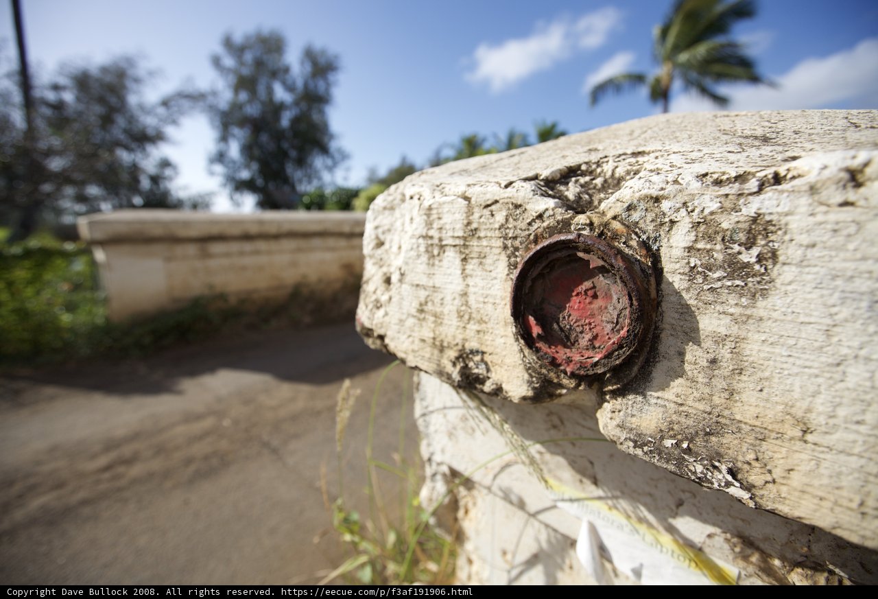 Red Button on a Cement Wall in Hawaii