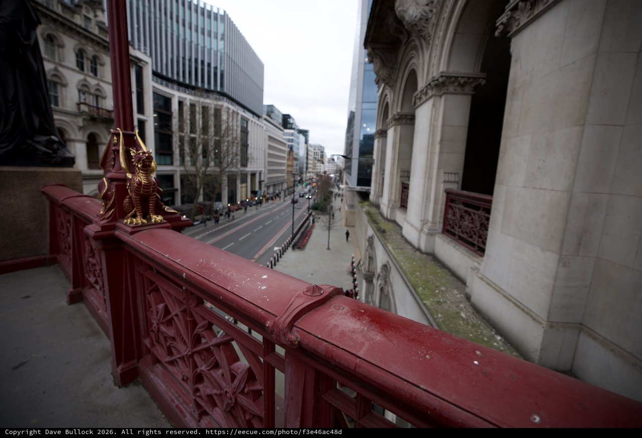 Ornate Red Bridge Overlooking London Street at Dusk