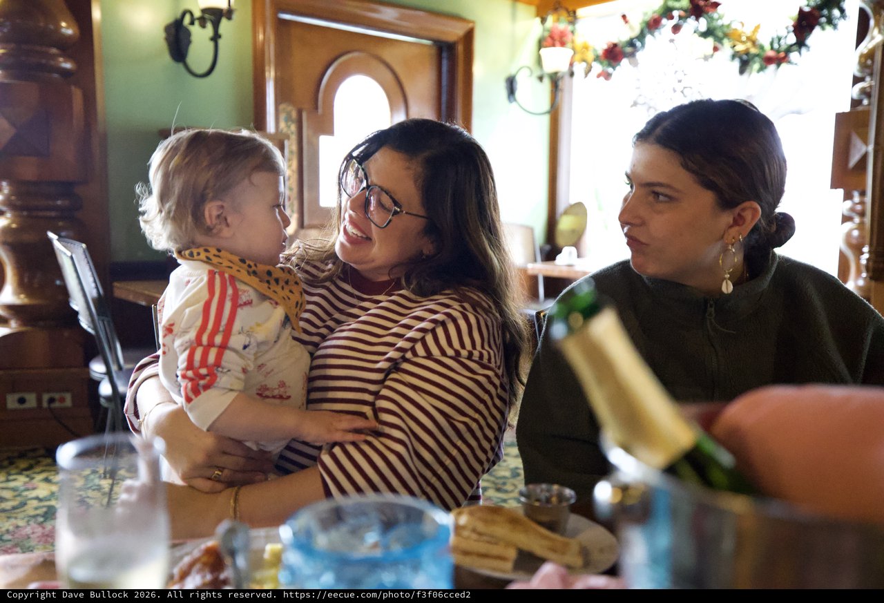 Three Generations Sharing a Joyful Holiday Meal